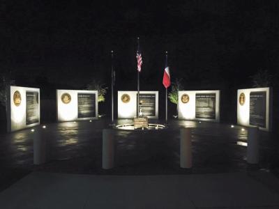 Crowley Veterans Plaza Memorials lit up at night